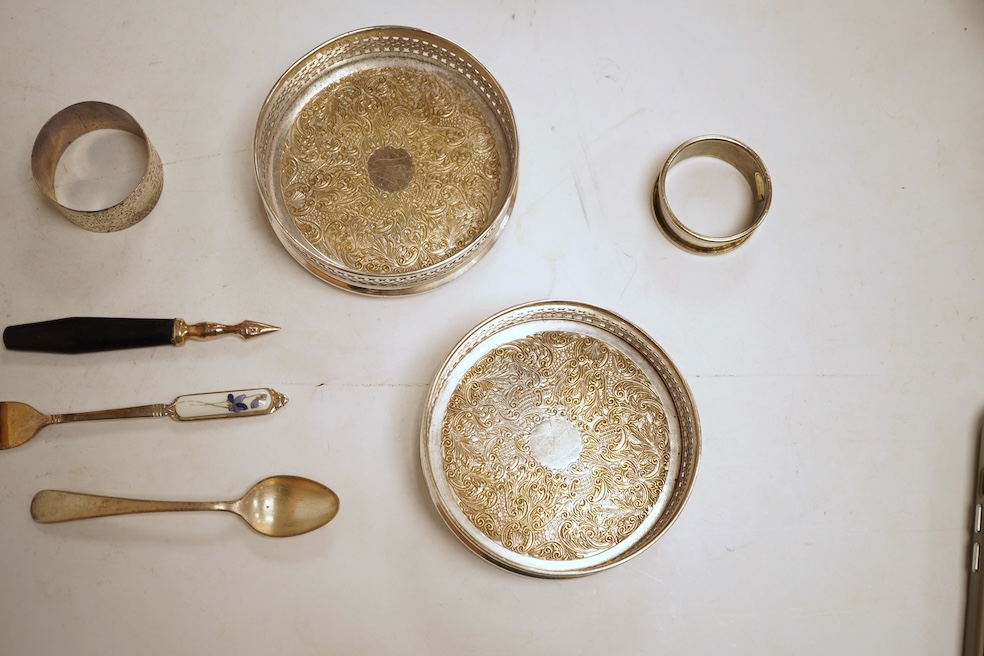 Two George V engine turned silver cigarette cases, largest 12.6cm, together with a pair of Asprey & Co silver ashtrays, a small silver dish, a silver condiment, six silver napkin rings, seven plated items and a quantity